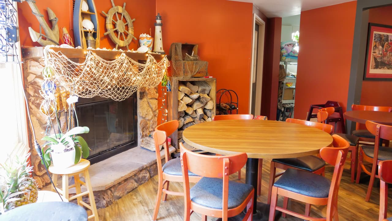 Dining room fireplace with nautical decor