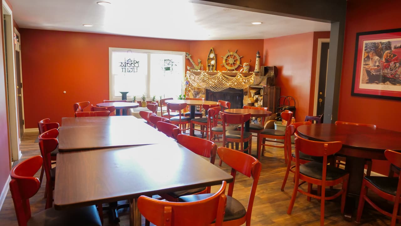 Long tables set up in the dining room for a group