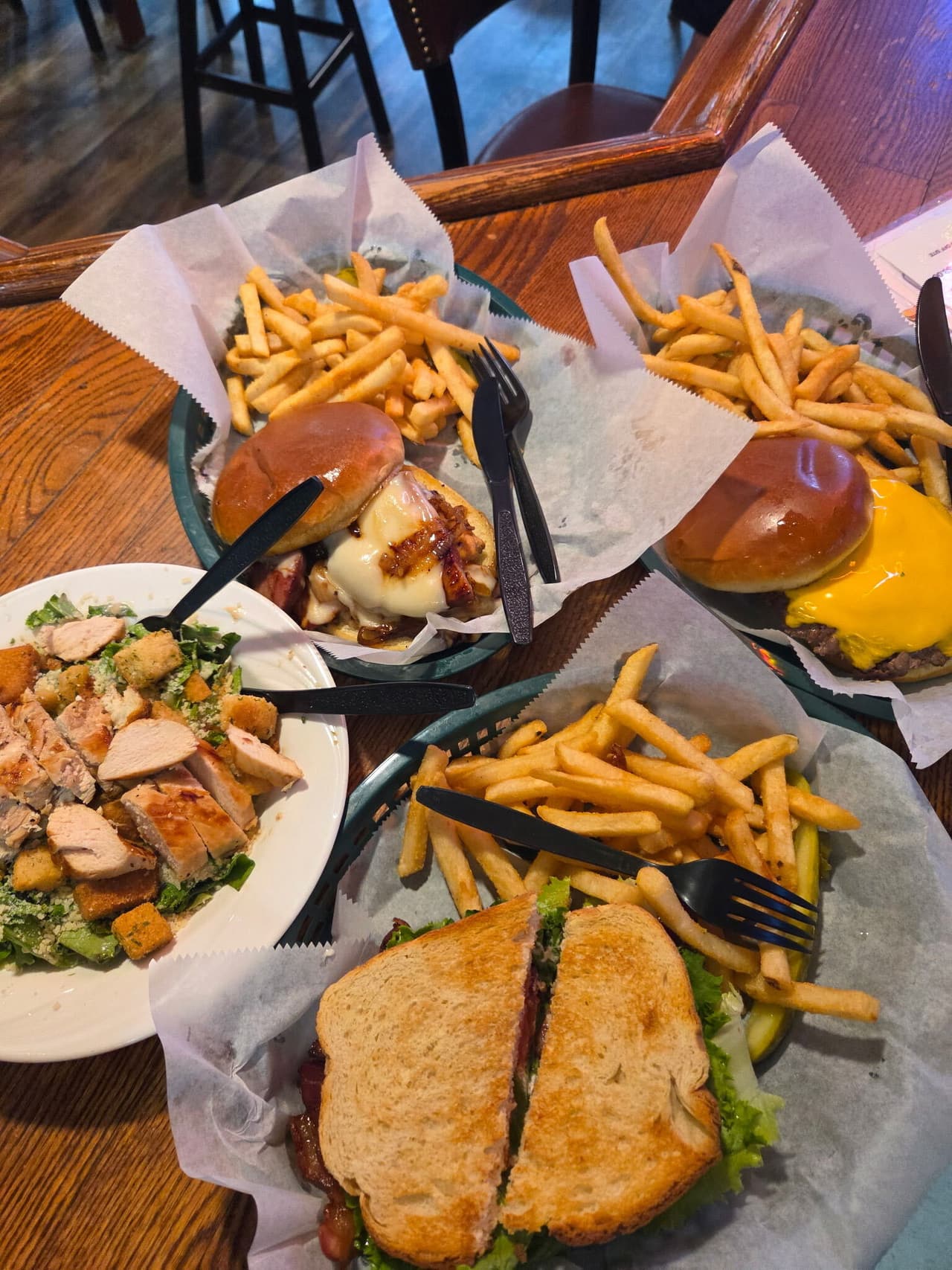 Burgers, a BLT and a chicken Caesar salad with fries at the Sunset Grill