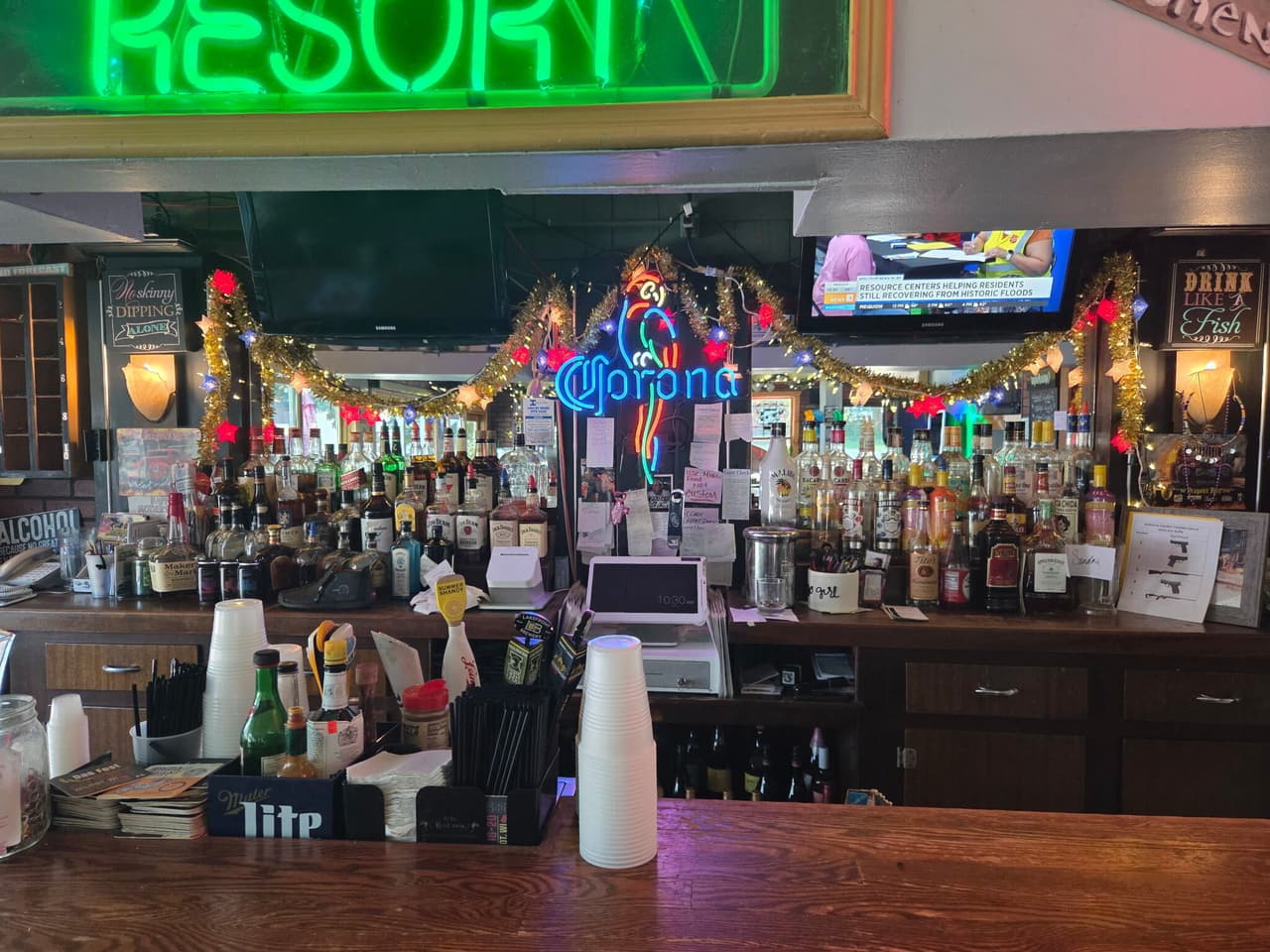 Behind the bar: bottles, garland lights and the Corona neon