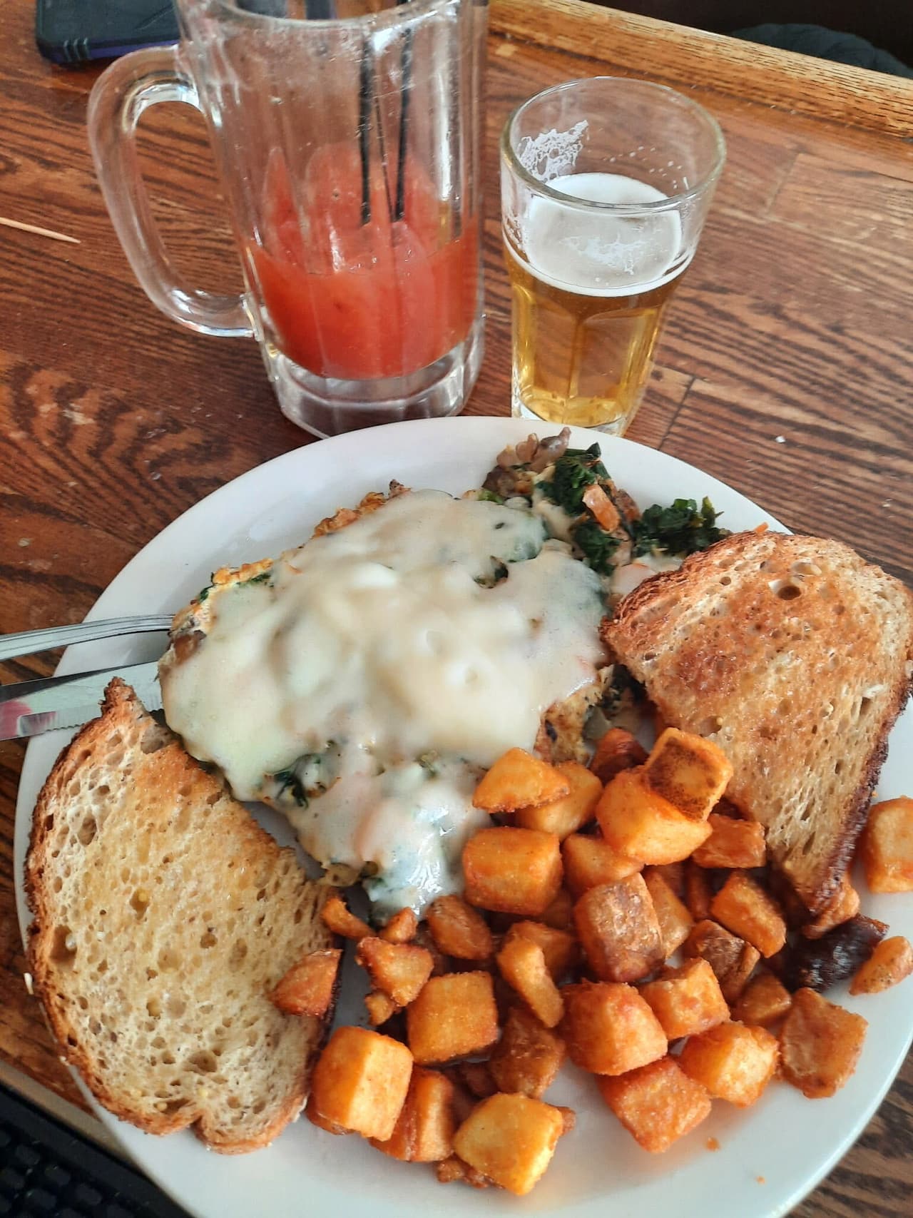 Breakfast with toast and potatoes, a Bloody Mary and a beer chaser