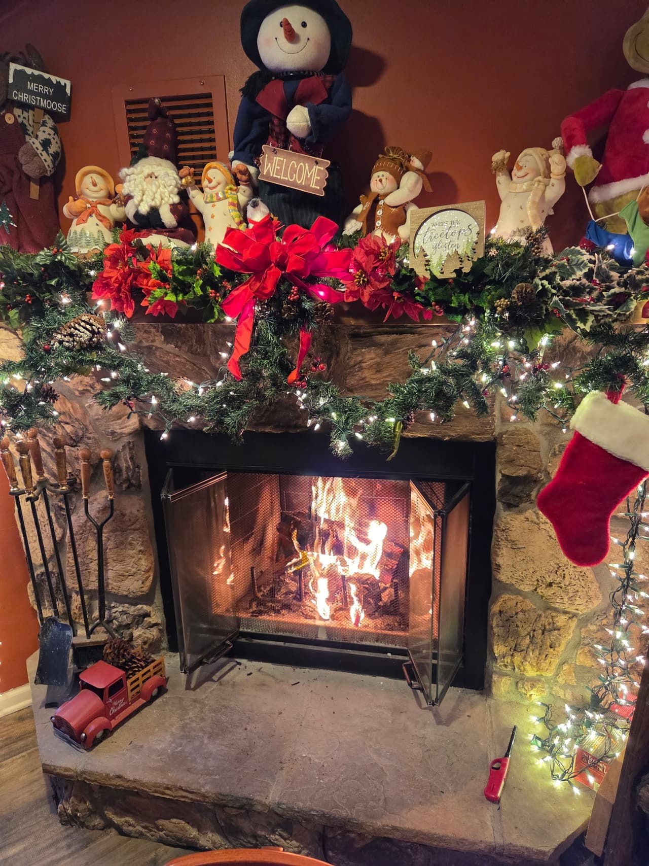 The dining room fireplace decorated for Christmas