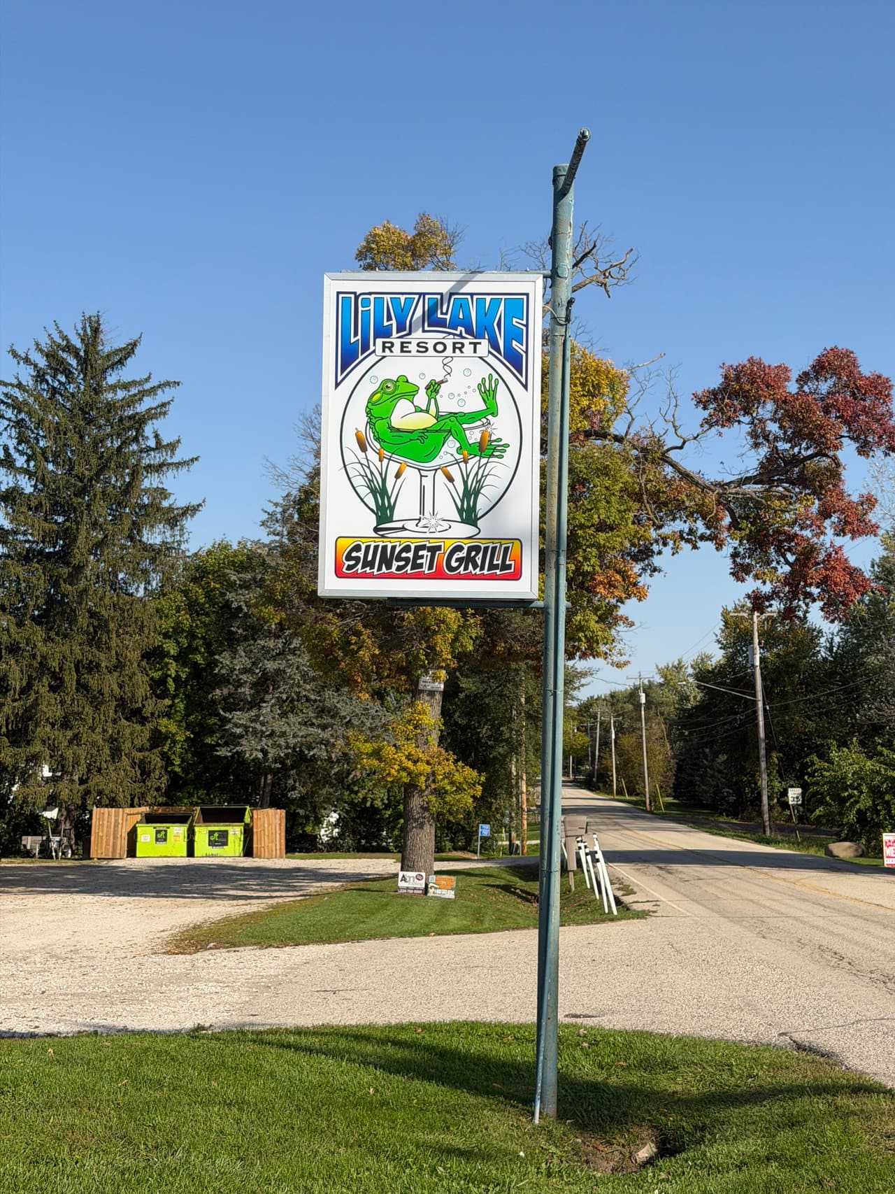 The Lily Lake Resort and Sunset Grill frog sign out by the road